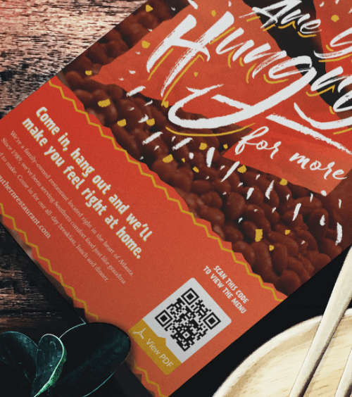 Um menu de restaurante com um QR Code que exibe uma versão PDF do cardápio quando escaneado.